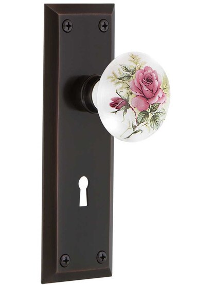New York Style Door Set with Rose Porcelain Knobs in Timeless Bronze.